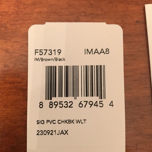 NWT authentic Coach Checkbook Wallet. Brown/black. New in the box. Matching purs - Picture 14 of 16